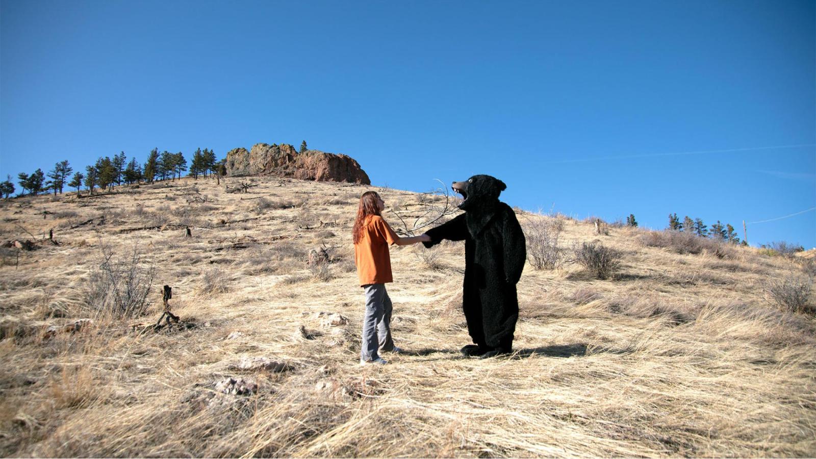 BearShakingHand- This is a photo of Lauren and the bear shaking hands.