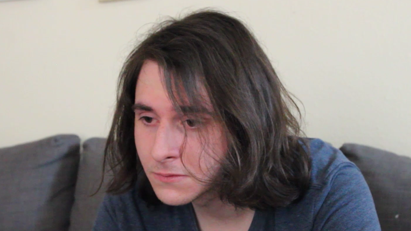 A closeup shot of the main character looking dejected