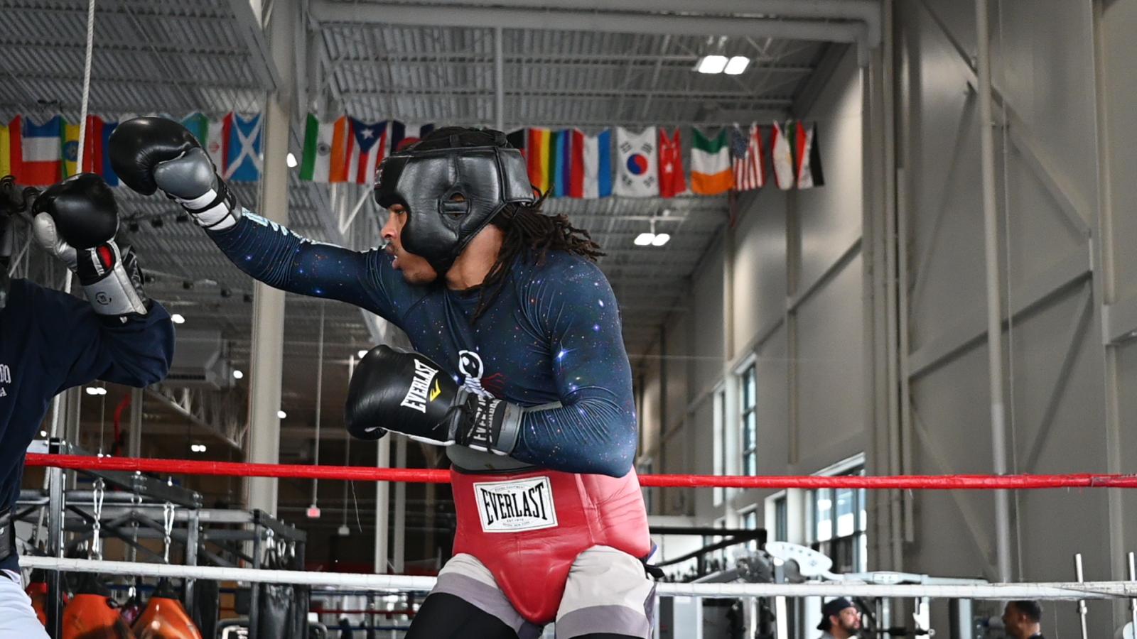 Shawn throws a punch while sparring