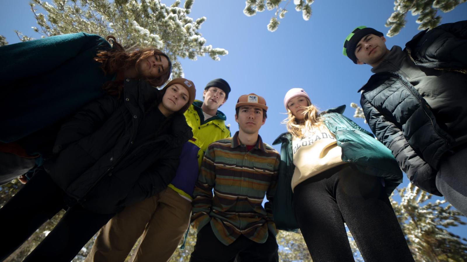 Groupshot 2- This is a photo of the cast looking down at the camera