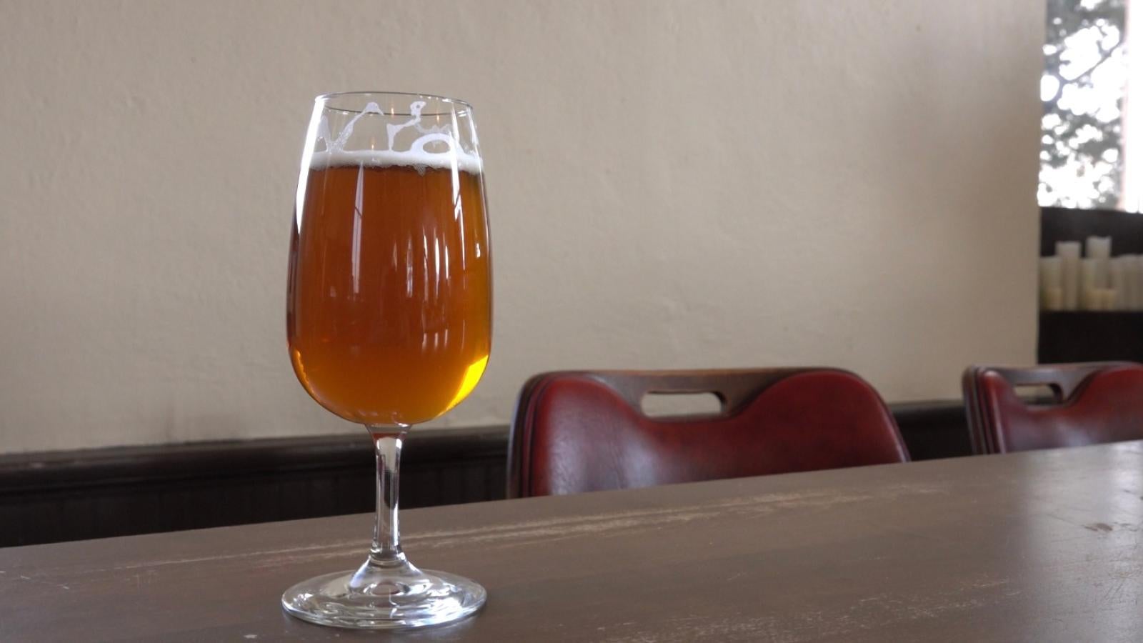 Full glass of beer on the bar