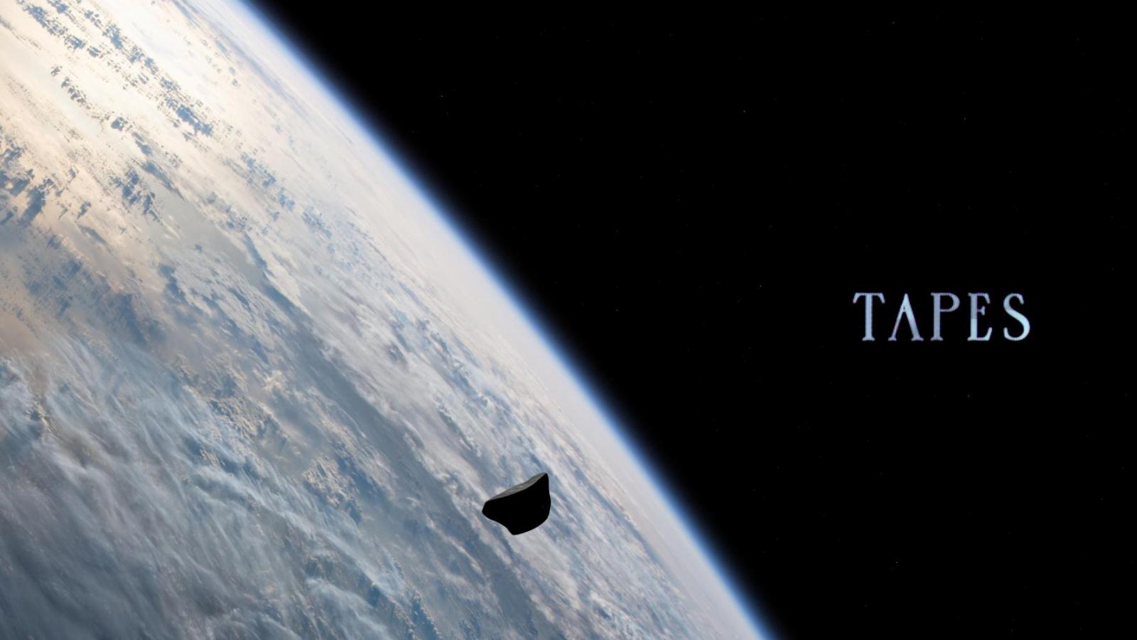 An asteroid floats above Earth
