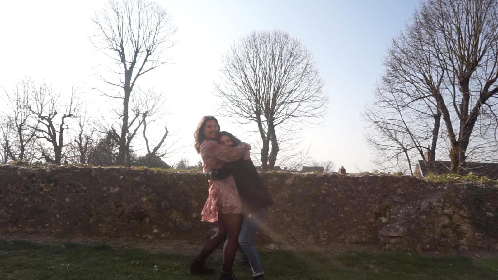 two people playing in a park on winter day