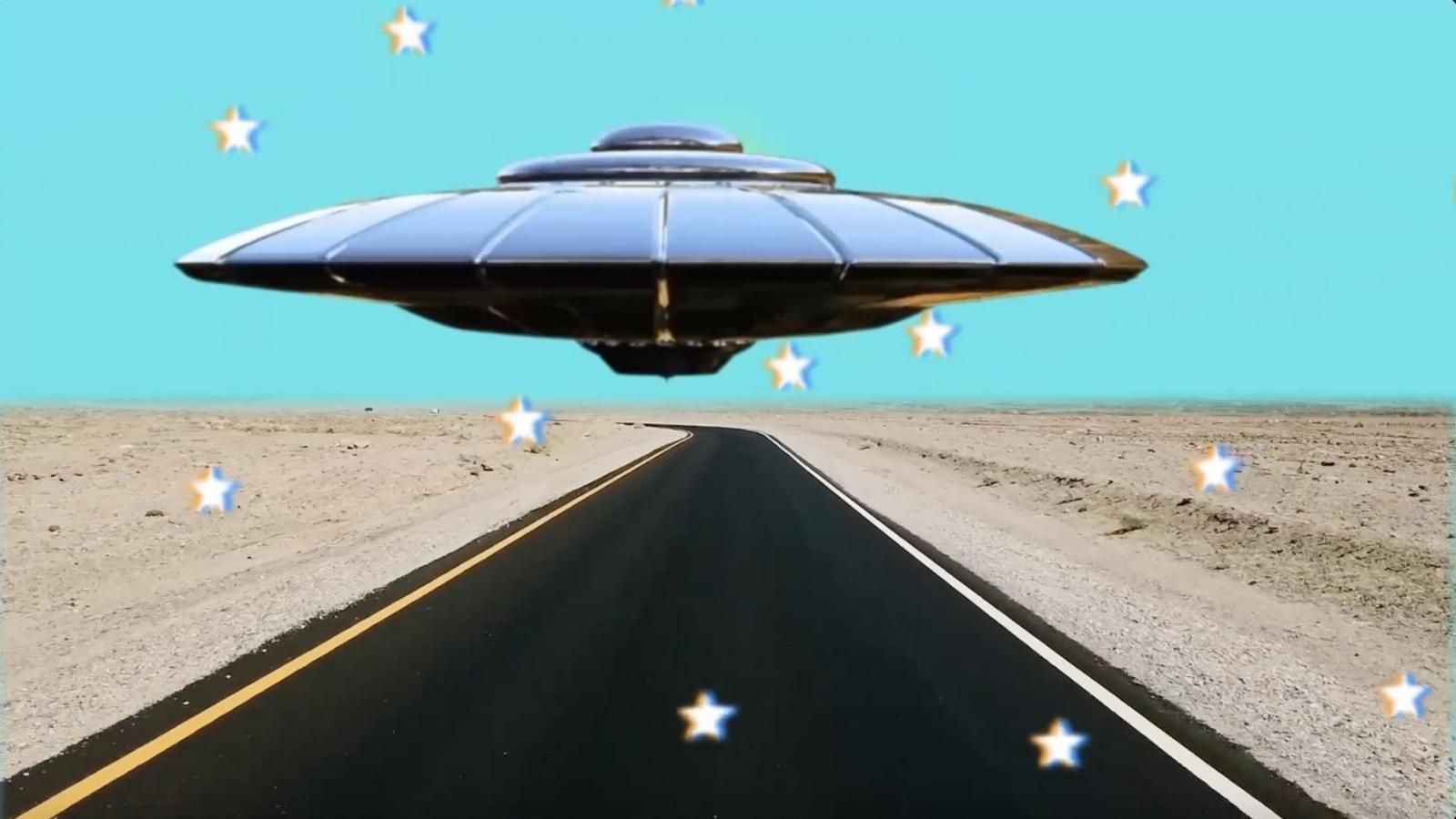Digital artwork of UFO over a highway in the desert