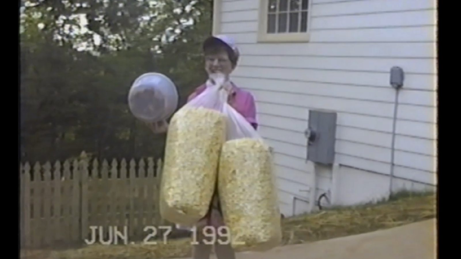 person holding large bag of popcorn