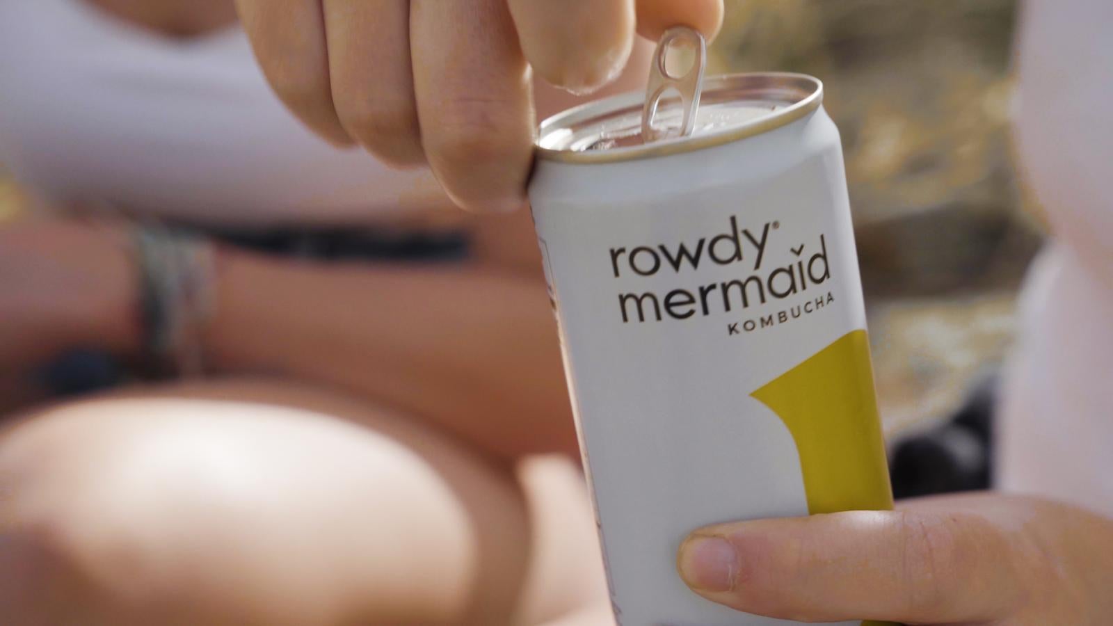 close up of soda can being opened