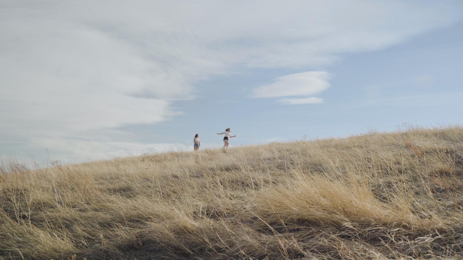 two people running in a field