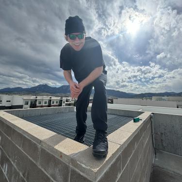 Connor Standing on Building
