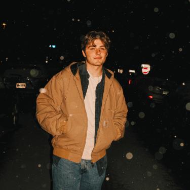 person with hands in pockets