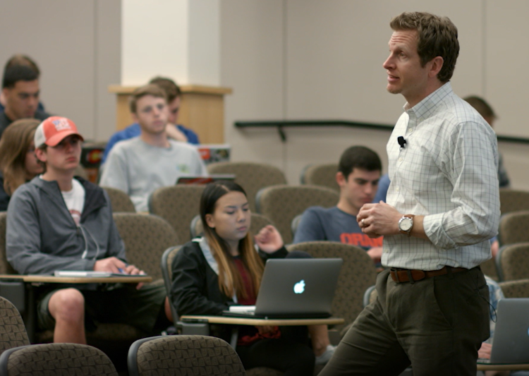 Photo of Matt Koschmann teaching a Communication class.