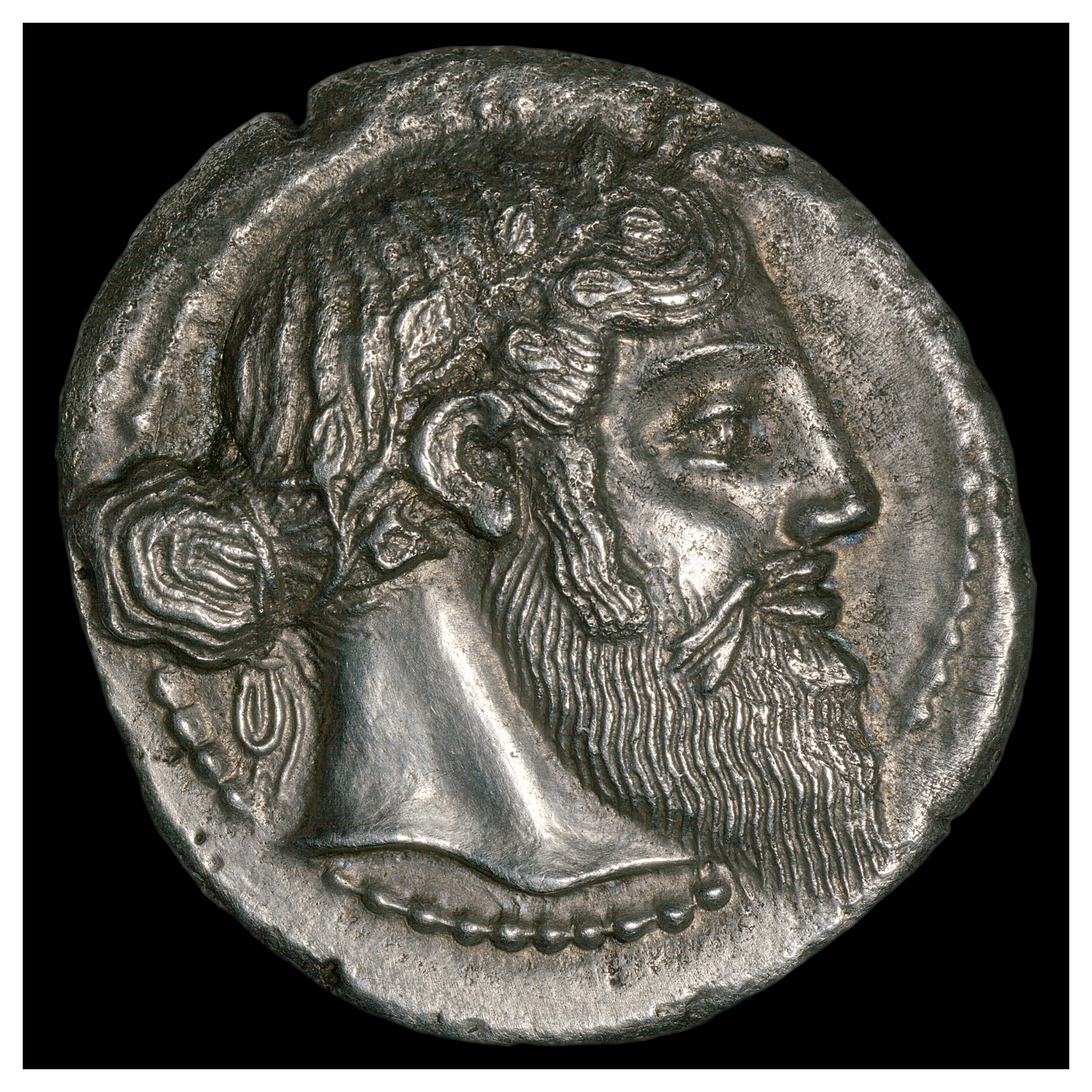 Silver Tetradrachm, Naxos, 461 BCE; Obverse: Head of Dionysus wearing an ivy wreath.