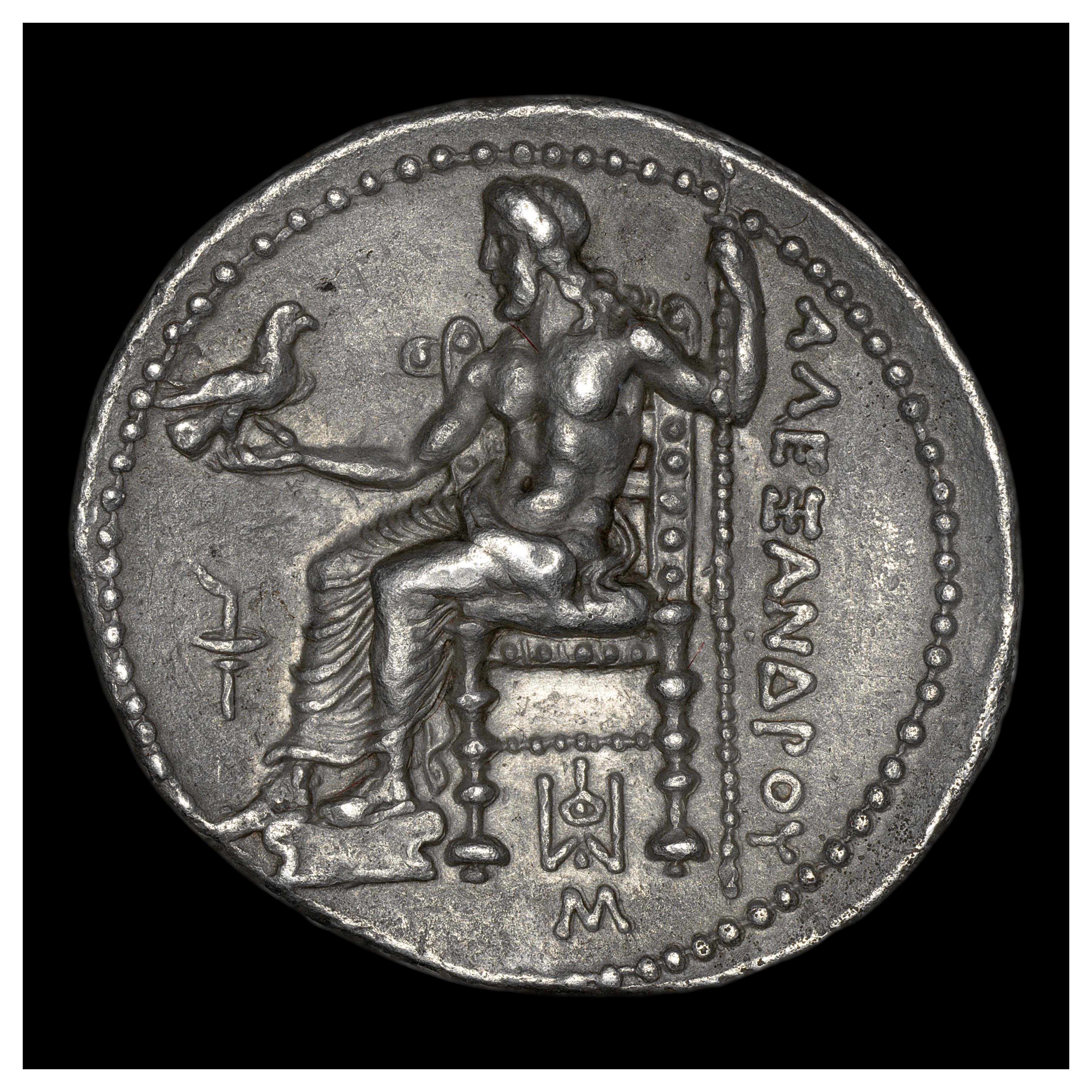 Silver Tetradrachm, Babylon, 325-323 BCE; Reverse: Zeus enthroned with eagle and scepter. Inscription ΑΛΕΞΑΝΔΡΟΥ (“ALEXANDROU” = “of Alexander”).