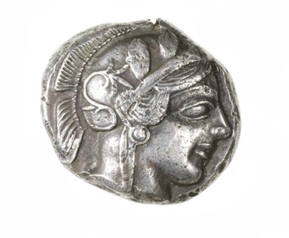 Silver Tetradrachm, Athens 454-404 BCE; Obverse: Helmeted head of Athena with olive leaves and floral scroll.