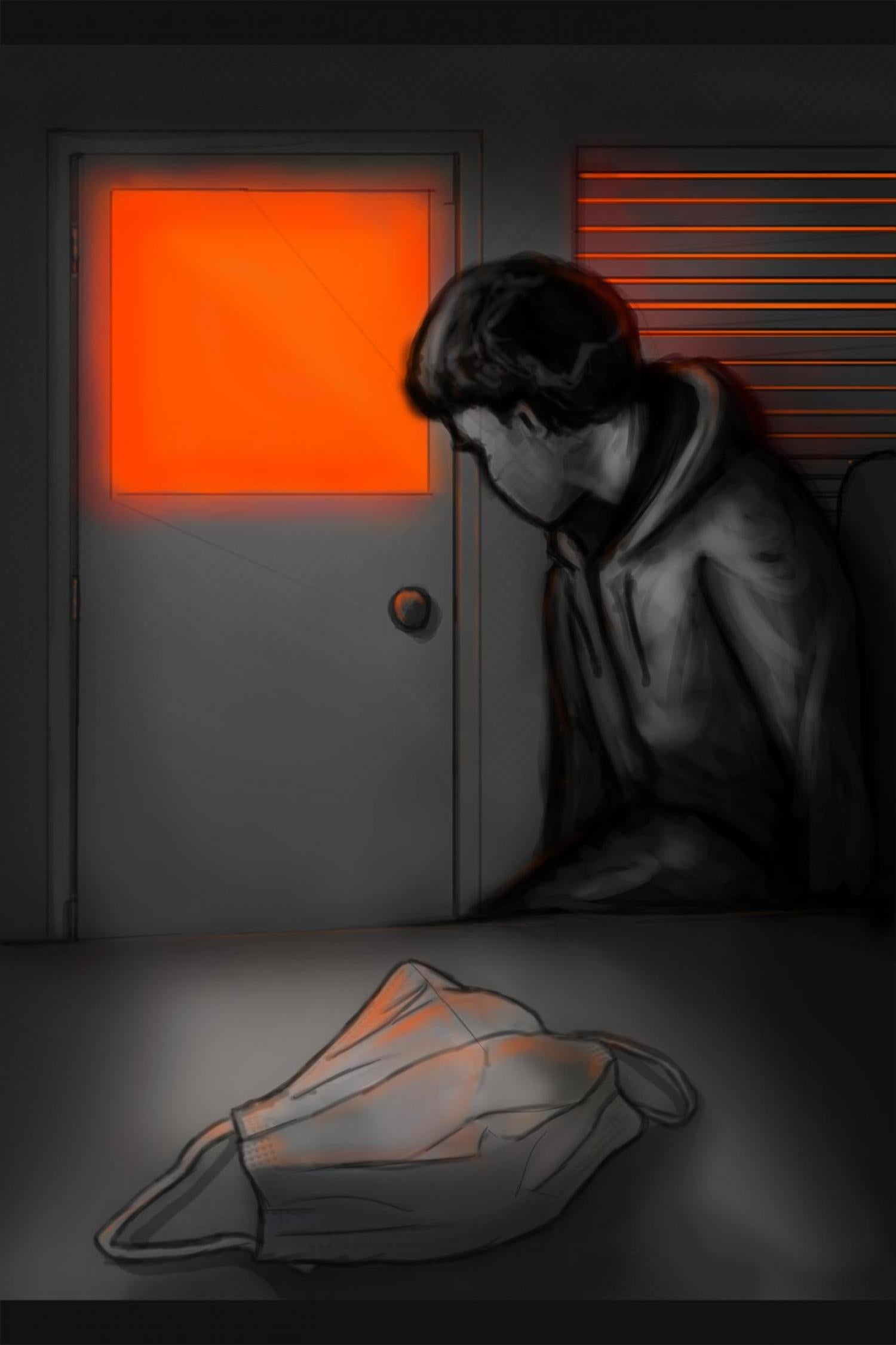 Boy looking at closed door with glowing orange window.