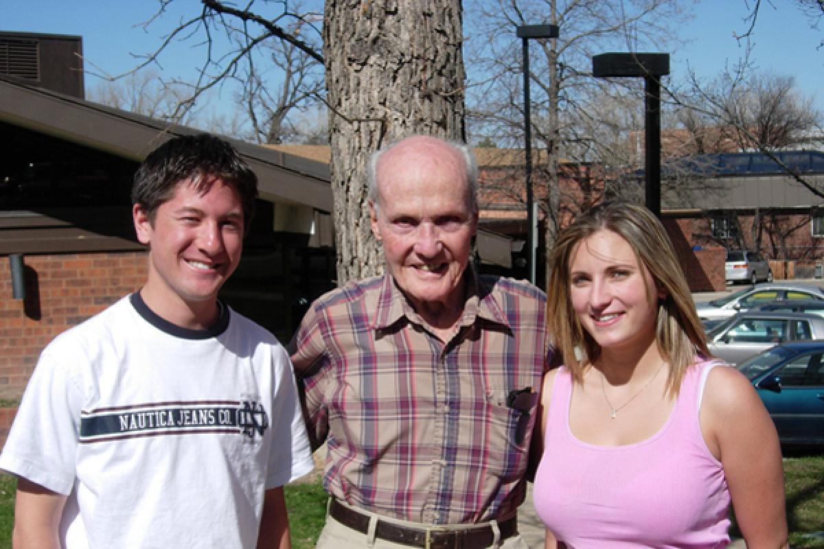 Charles with two students