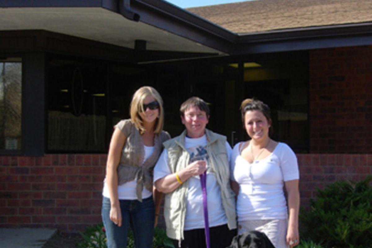 Margaret with dog and two student participants