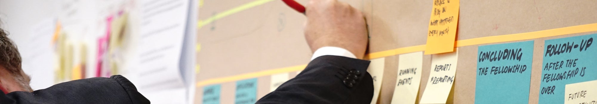 man working on a project board