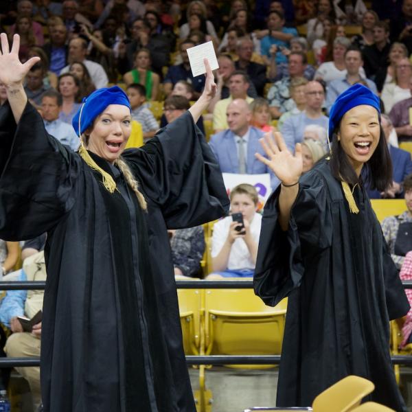 New PhDs Liz Woodruff and Lauren Chun are somewhat happy