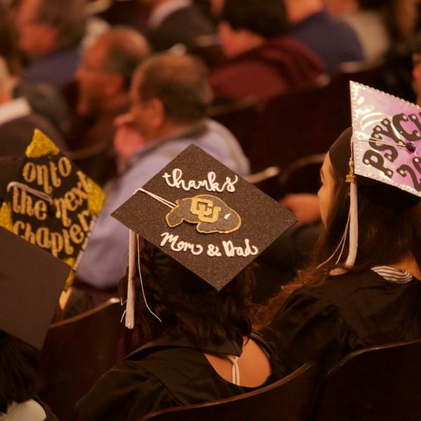 Mortarboard trio (L to R): "On to the next chapter," "thanks Mom & Dad," "Psych 2017"