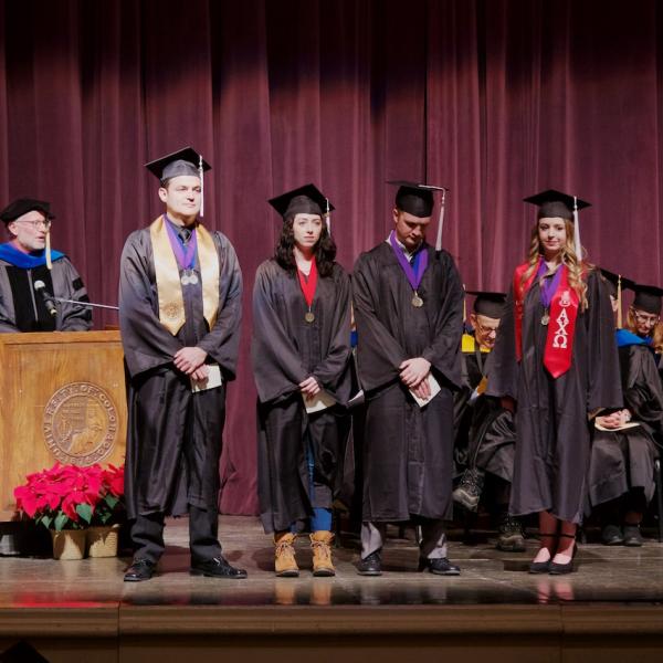 Professor Mark Whisman, Director the the Departmental Honors Program, introduces the Latin honors graduates