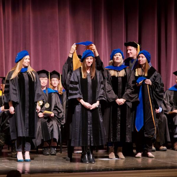 Laura Michaelson is hooded by her mentor Professor Yuko Munakata