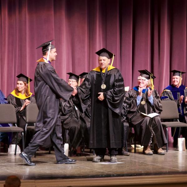 The prized handshake from the chair