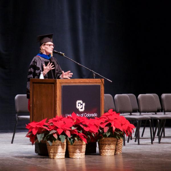 Emcee Professor Tina Pittman Wagers warms up the crowd