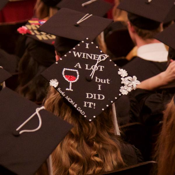Mortarboard message #1: "I wined a lot but I did it! thanks Mom and Dad." (presumably she was 21 when she matriculated)