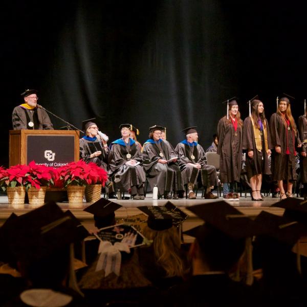 Professor Mark Whisman, Director of Undergraduate Studies, introduces those students graduating with Latin Honors