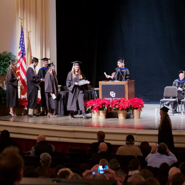The undergraduates then walked across the stage to have their names announced and receive a diploma (*cough* cover)...