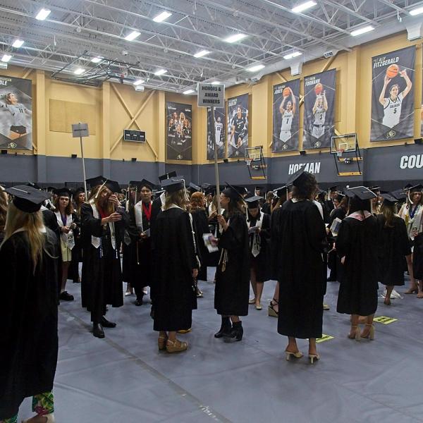 The barely controlled chaos of lining the undergrads up for the processional