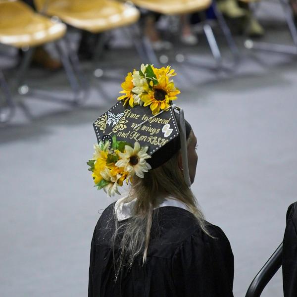 Another mortarboard: "Time to spread my wings and flourish"