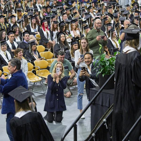 Parents jockey for position to get their grad crossing the stage