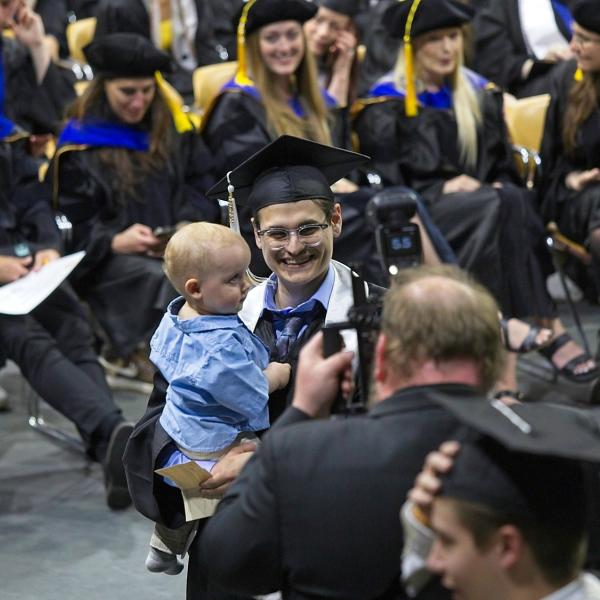A proud father (presumably) who happens to be graduating. Awww, part II.