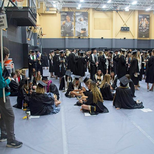 Thankfully, these students were not staging a sit-in. They were just sitting while waiting for all the graduates to assemble for the processional