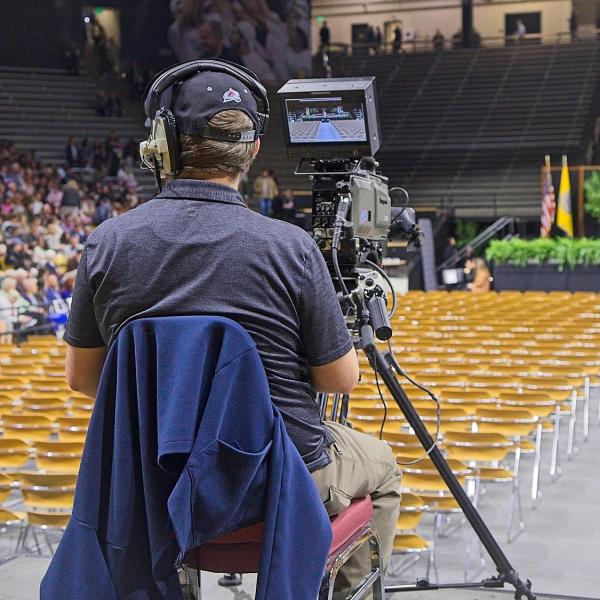 The videographer of the livestream of the event awaits its start