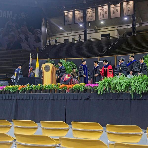 The faculty process to the stage, using the phrase loosely. There appears to be some confusion about seating