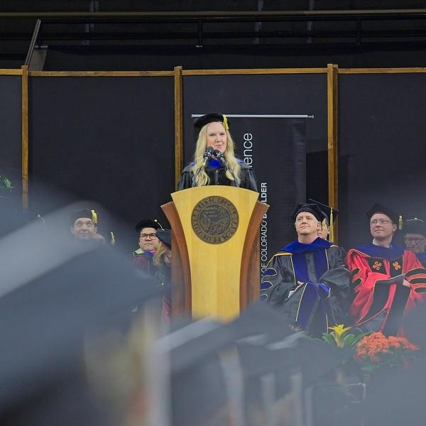 Faculty member Chelsea Pierotti addresses the graduates