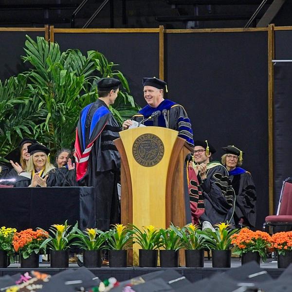 Brett King receives the Faculty Service Award. This picture is for his 92-year-old mom by request. (Belated Happy Mother's Day!)