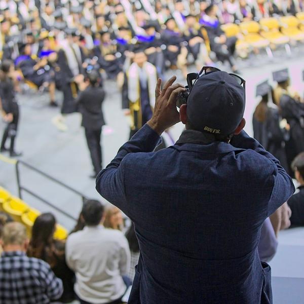 I took this shot out of admiration for this man. As far as I knew, he waited patiently all ceremony in this spot (standing, no less) to take a shot of a graduate. And because his camera had a zoom lens, he didn't need to move to take some shots.