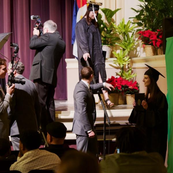 Assume the position in front of the green screen for your portrait picture