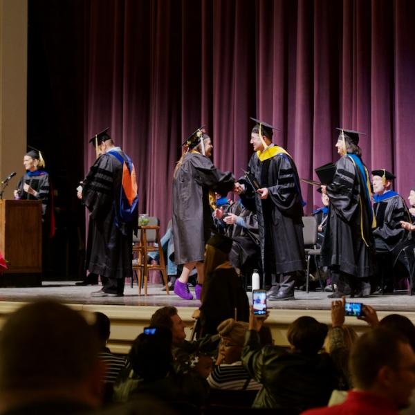 Another graduate crosses the stage--she might be the happiest one yet