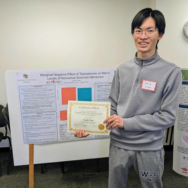 Junshi Chen with his poster