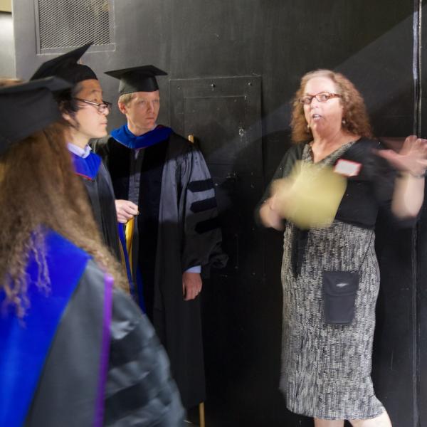 Lead Academic Advisor Laurel Amsel, in a flurry of hand-waving, herds the cats, PhDs (aka professors)