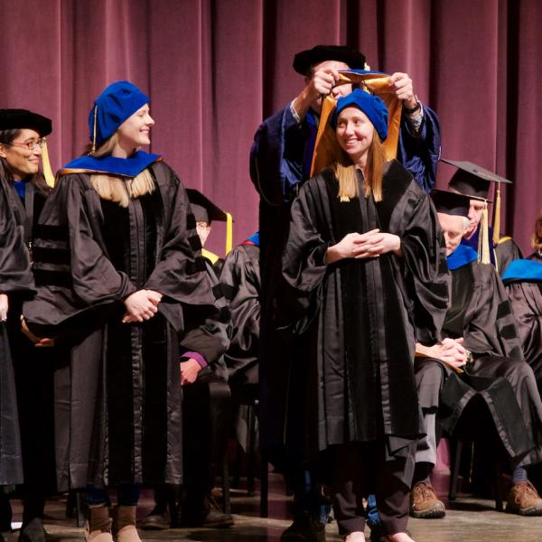 Jessica Mollick is hooded by her mentor Professor Randy O'Reilly