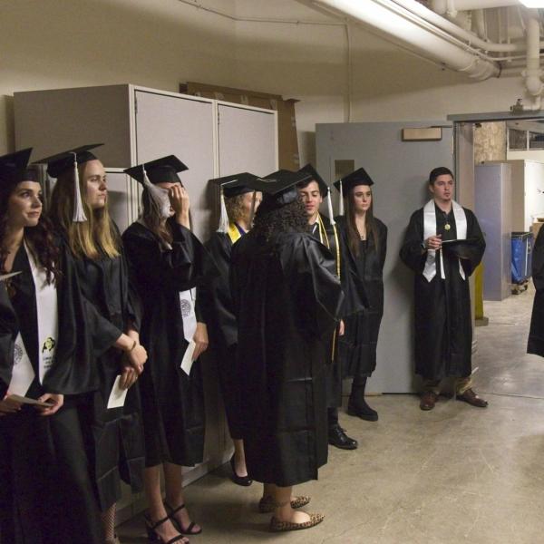 The undergraduates assemble before the procession in the bowels of Macky