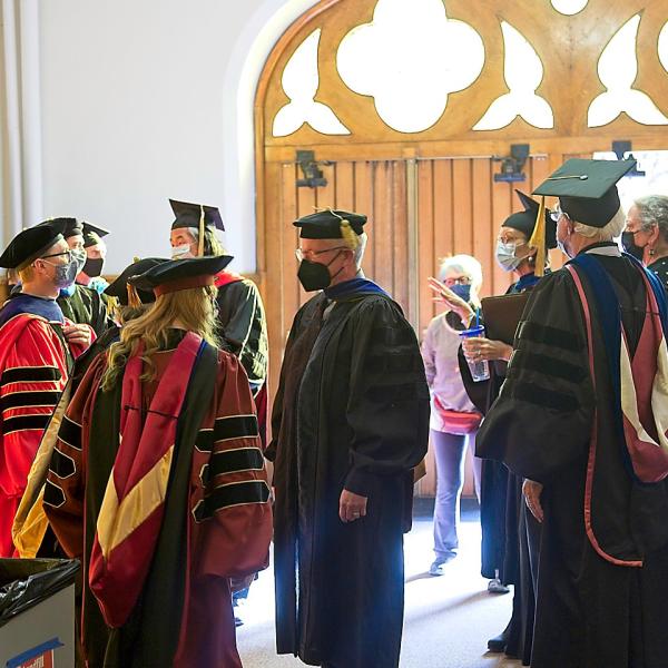 The faculty await the processional