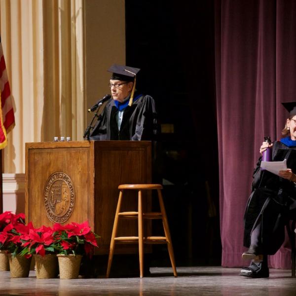 Chair of the department Jerry Rudy addresses the graduates