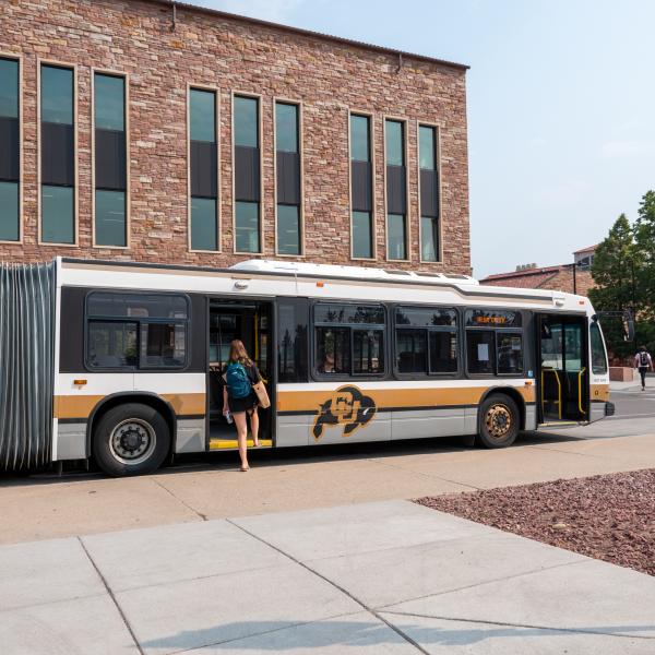 Student boarding a CU Buff Bus