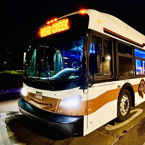 A Parking and Transportation Service Buff Bus on campus at the University of Colorado Boulder.